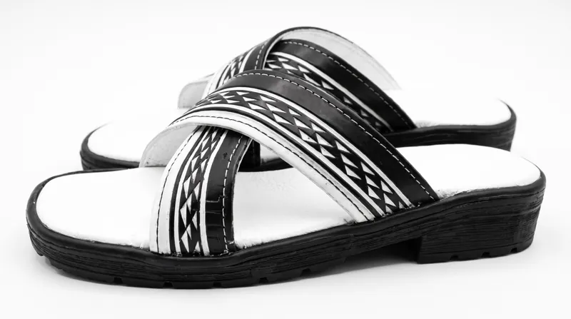 Low side view of one sandal and its stitched straps